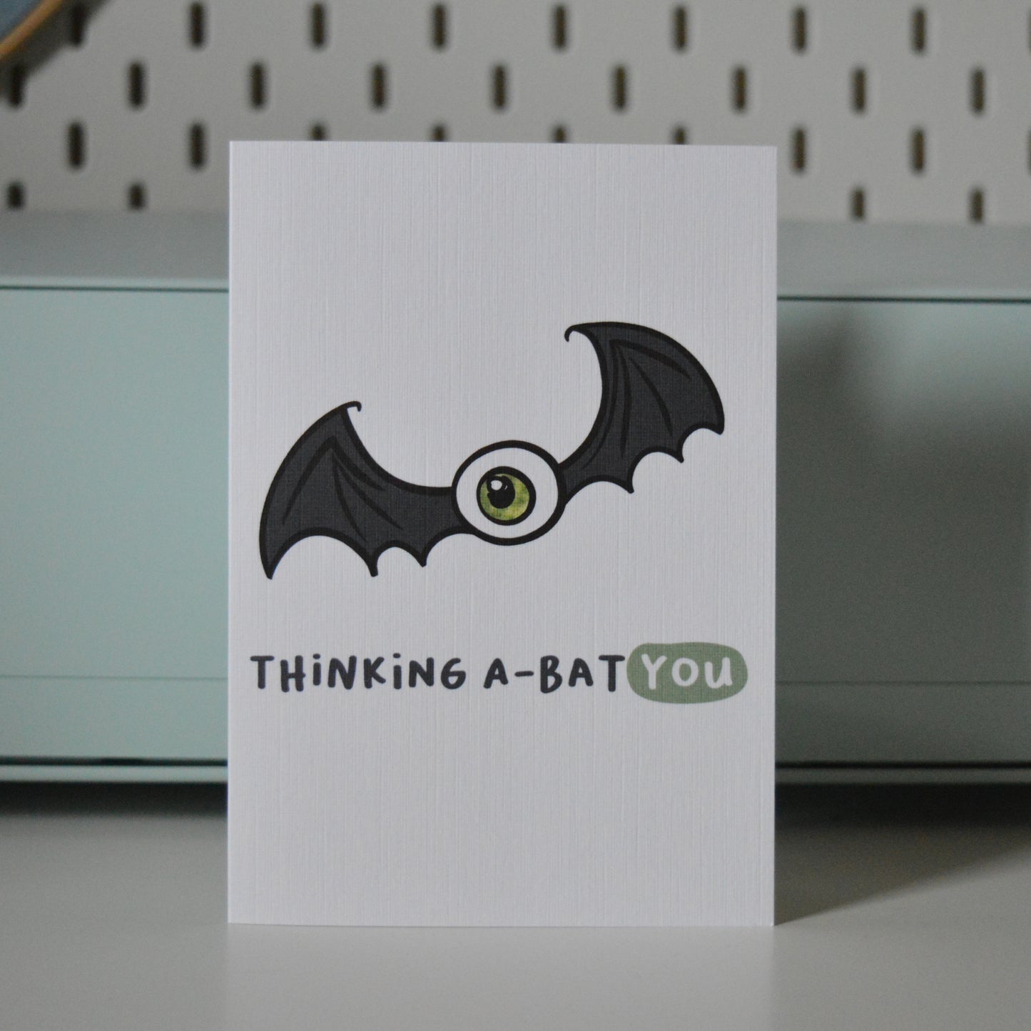 Card with a bat illustration and text 'Thinking A-Bat You'