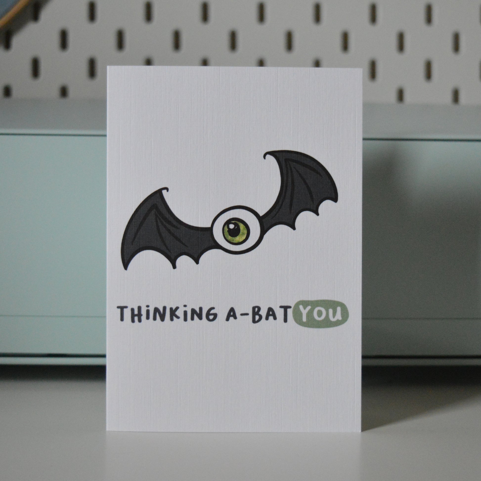 Card with a bat illustration and text 'Thinking A-Bat You'