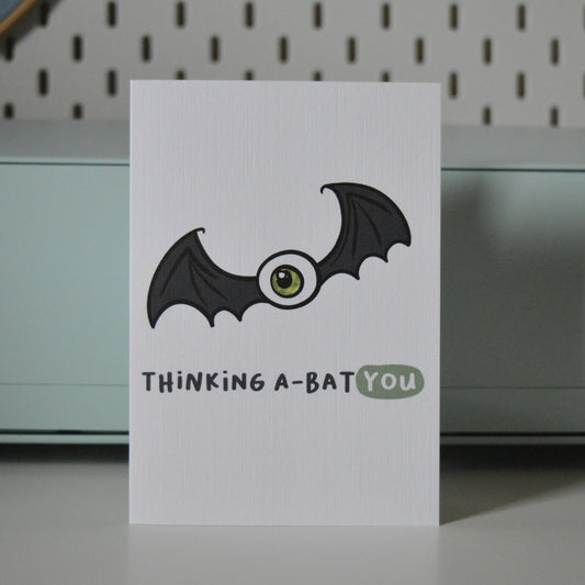 Card with a bat illustration and text 'Thinking A-Bat You'